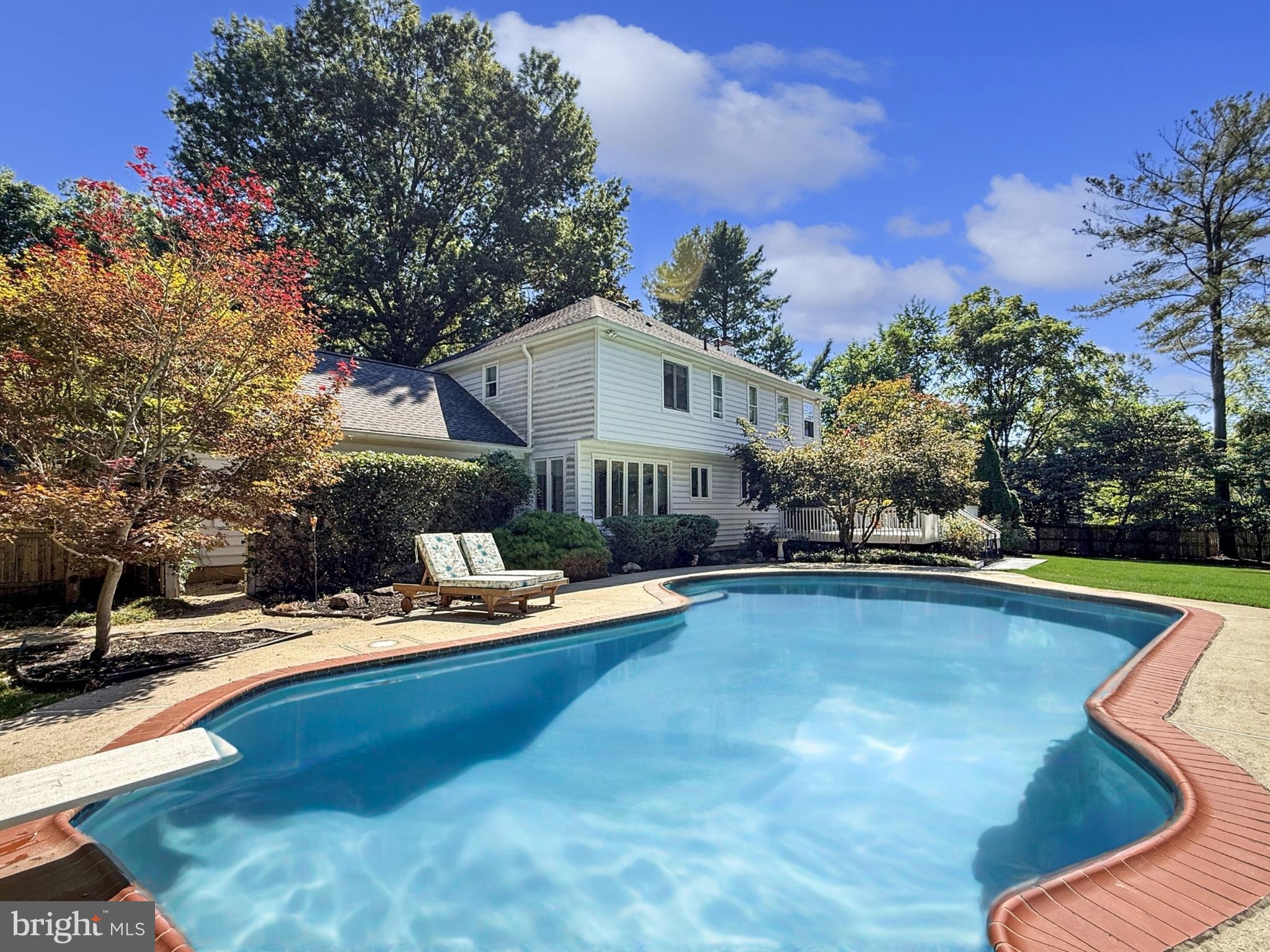 21600 Glendalough Road Gaithersburg, MD 20882 - Photo 7 of 64 a view of a house with pool and sitting area