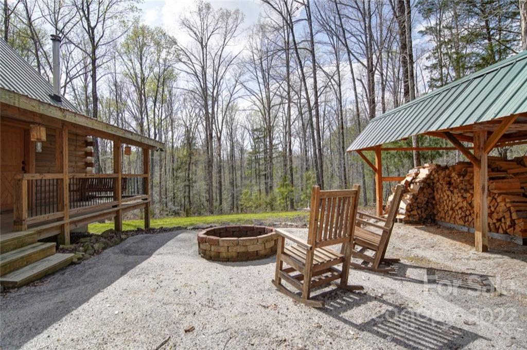 477 George Ratliff Road Peachland, NC 28133 - Photo 3 of 48 a view of a patio with a table chairs and a floor to ceiling window