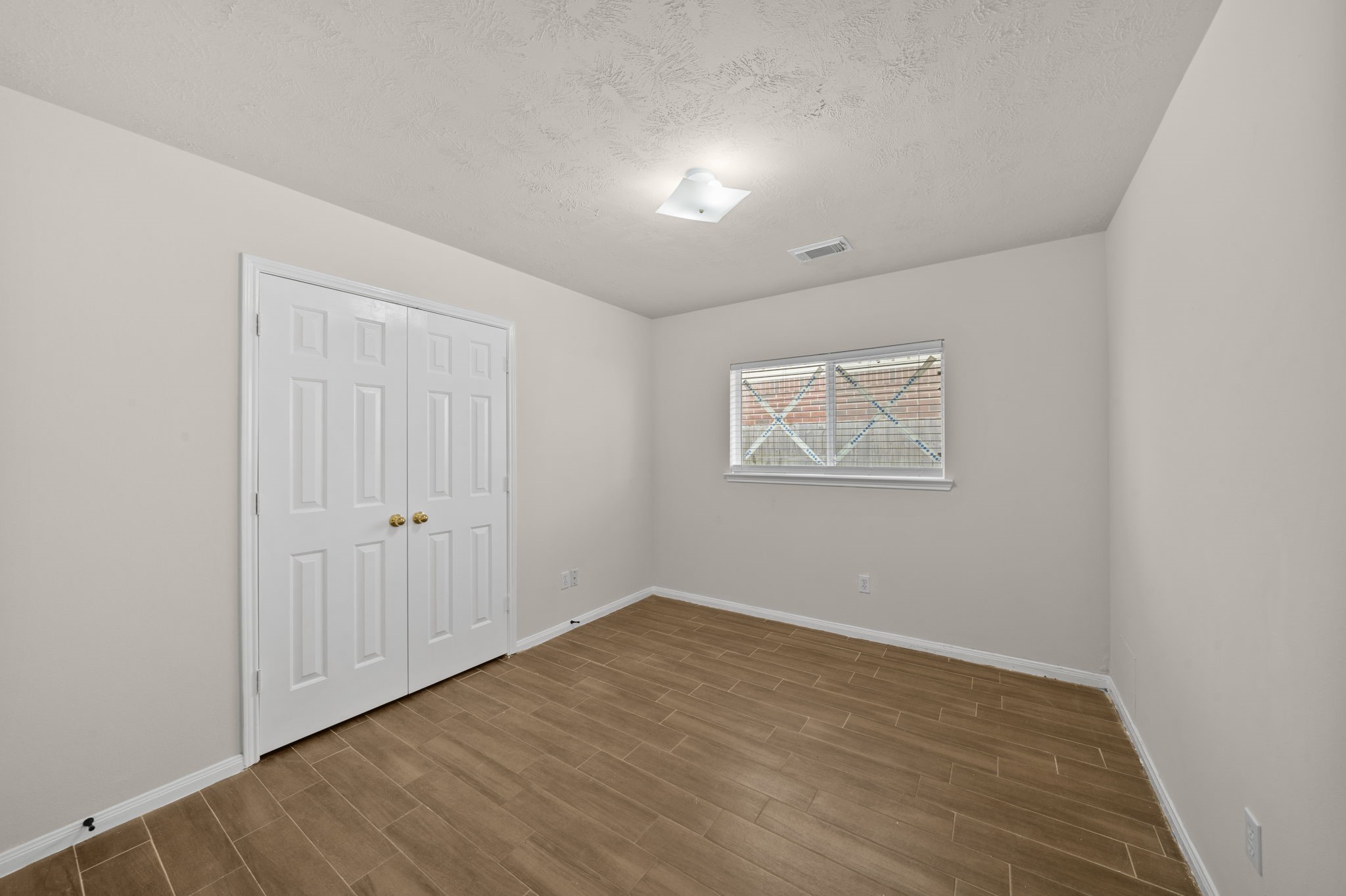 10330 Turrett Point Lane Houston, TX 77064 - Photo 11 of 15 a view of an empty room with wooden floor