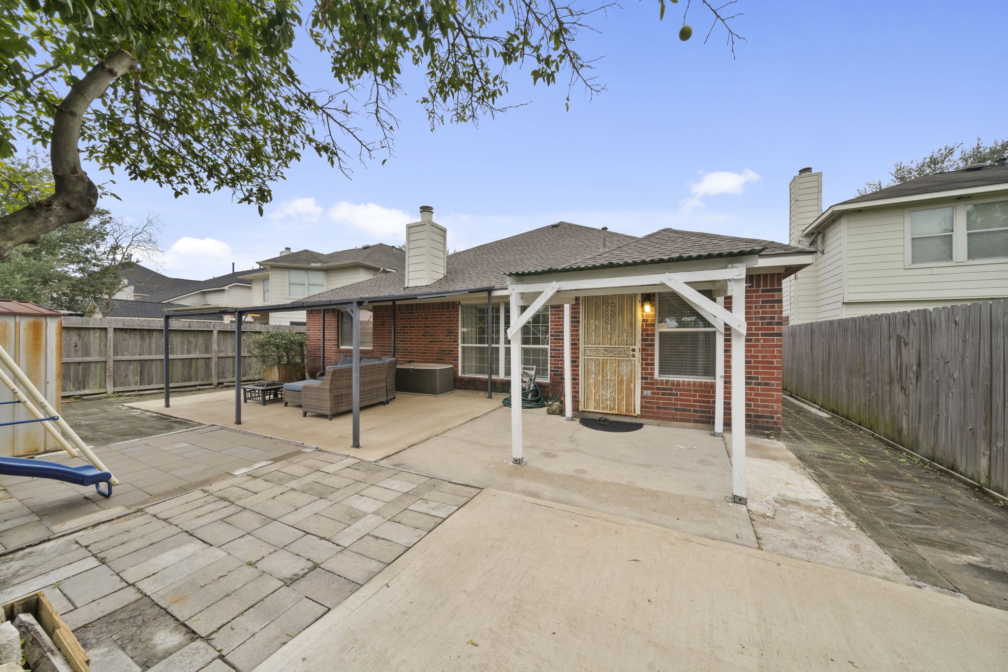 10330 Turrett Point Lane Houston, TX 77064 - Photo 14 of 15 a view of a house with backyard and sitting area