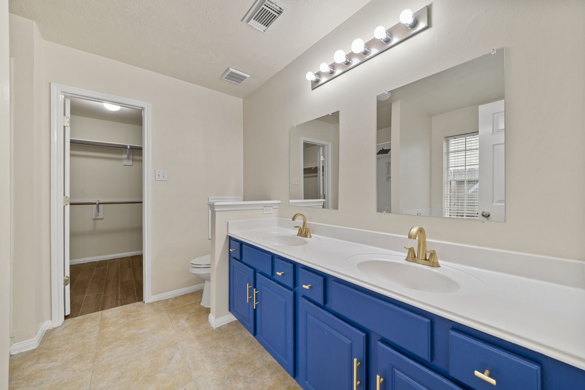 10330 Turrett Point Lane Houston, TX 77064 - Photo 8 of 15 a spacious bathroom with a double vanity sink and a mirror