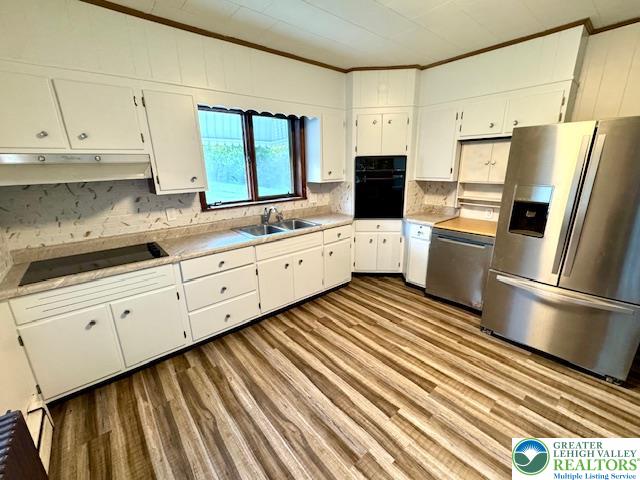 1911 Echo Road Slatington, PA 18080 - Photo 15 of 38 a kitchen with white cabinets stainless steel appliances and a window