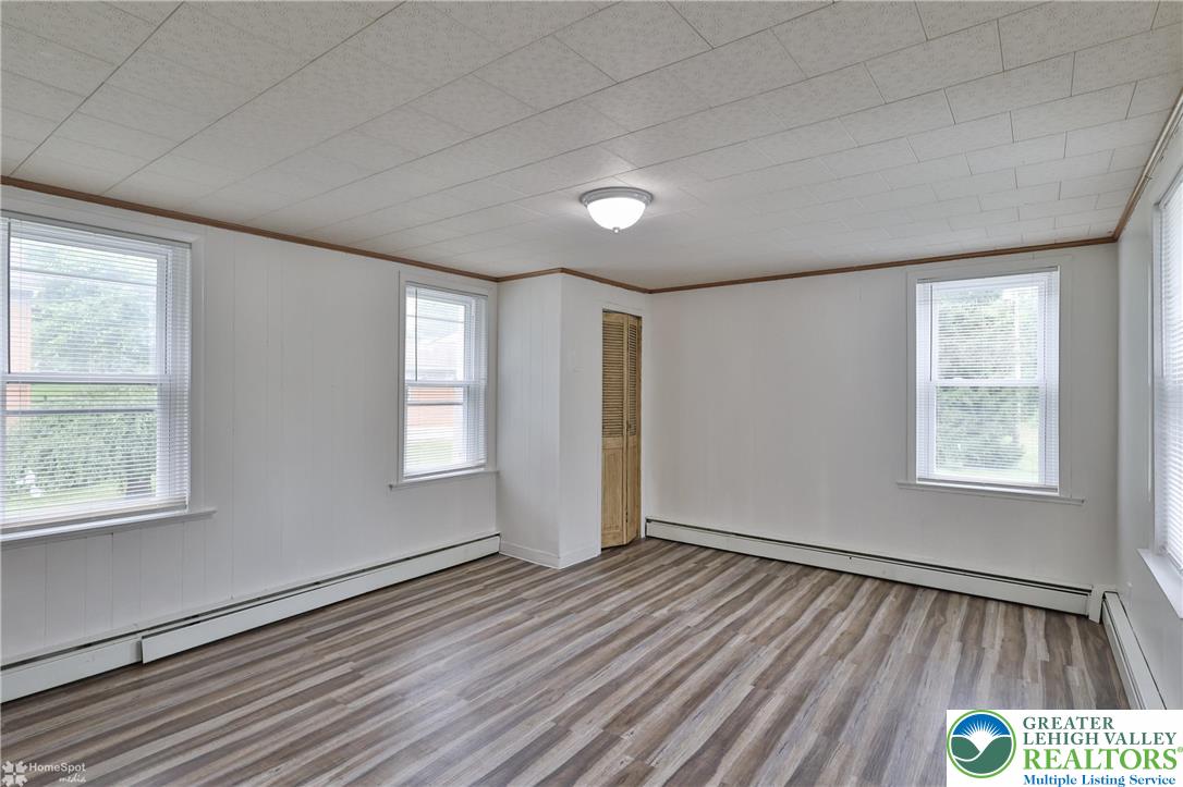 1911 Echo Road Slatington, PA 18080 - Photo 30 of 38 a view of an empty room with wooden floor and a window