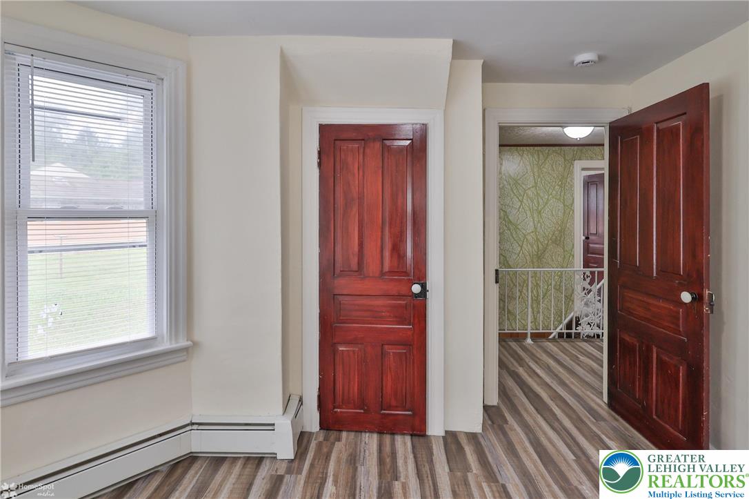 1911 Echo Road Slatington, PA 18080 - Photo 35 of 38 a view of a hallway with wooden floor and closet