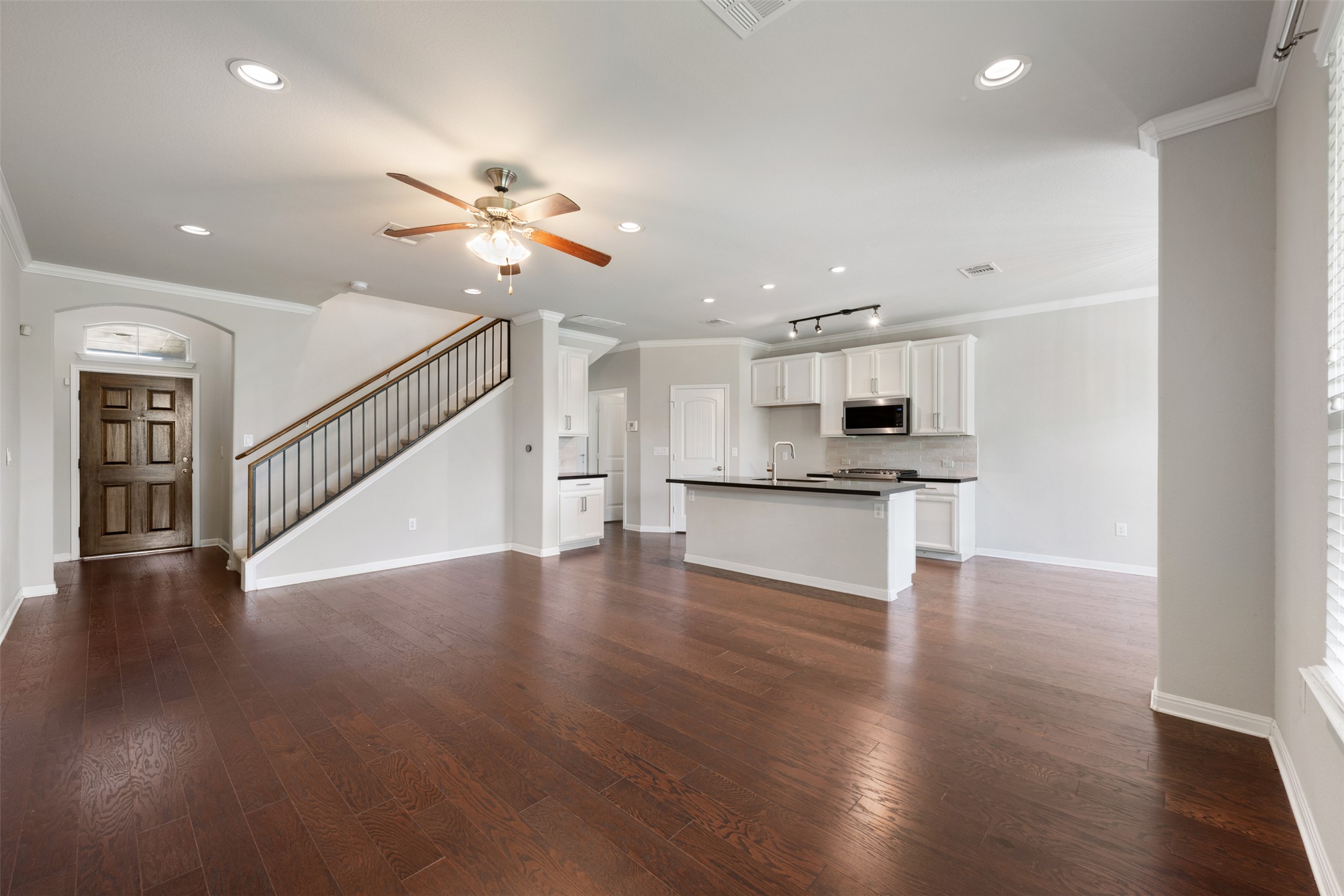 211 Parable Cove Pflugerville, TX 78660 - Photo 6 of 40 Open-concept living area featuring wood-finish flooring, recessed lighting, and a ceiling fan
