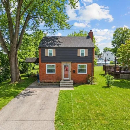 front view of a house with a yard