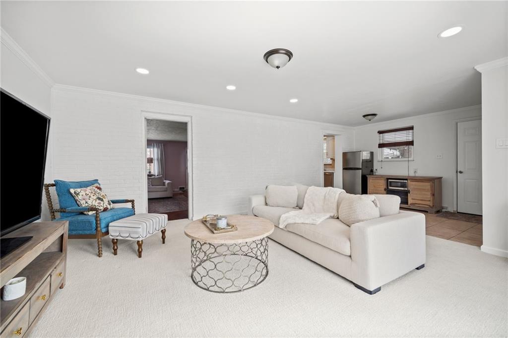 2079 Spring Valley Road Pittsburgh, PA 15243 - Photo 17 of 35 a living room with furniture and a flat screen tv