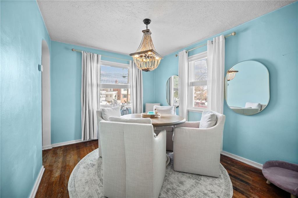 2079 Spring Valley Road Pittsburgh, PA 15243 - Photo 10 of 35 a dining room with chandelier fan and wooden floor
