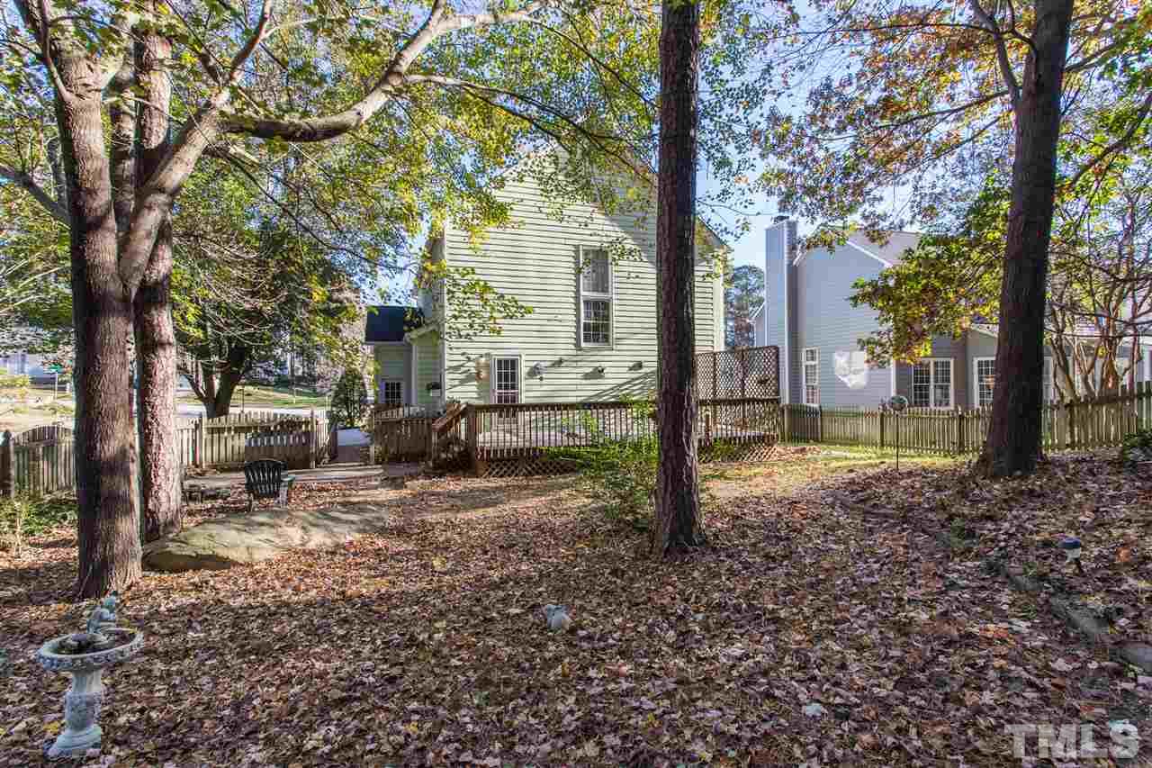 8612 Swarthmore Drive Raleigh, NC 27615 - Photo 4 of 30 a view of a yard with a tree