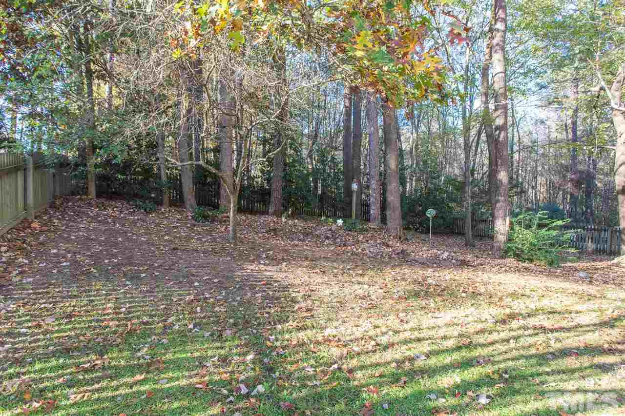 8612 Swarthmore Drive Raleigh, NC 27615 - Photo 6 of 30 a backyard of a house with lots of green space