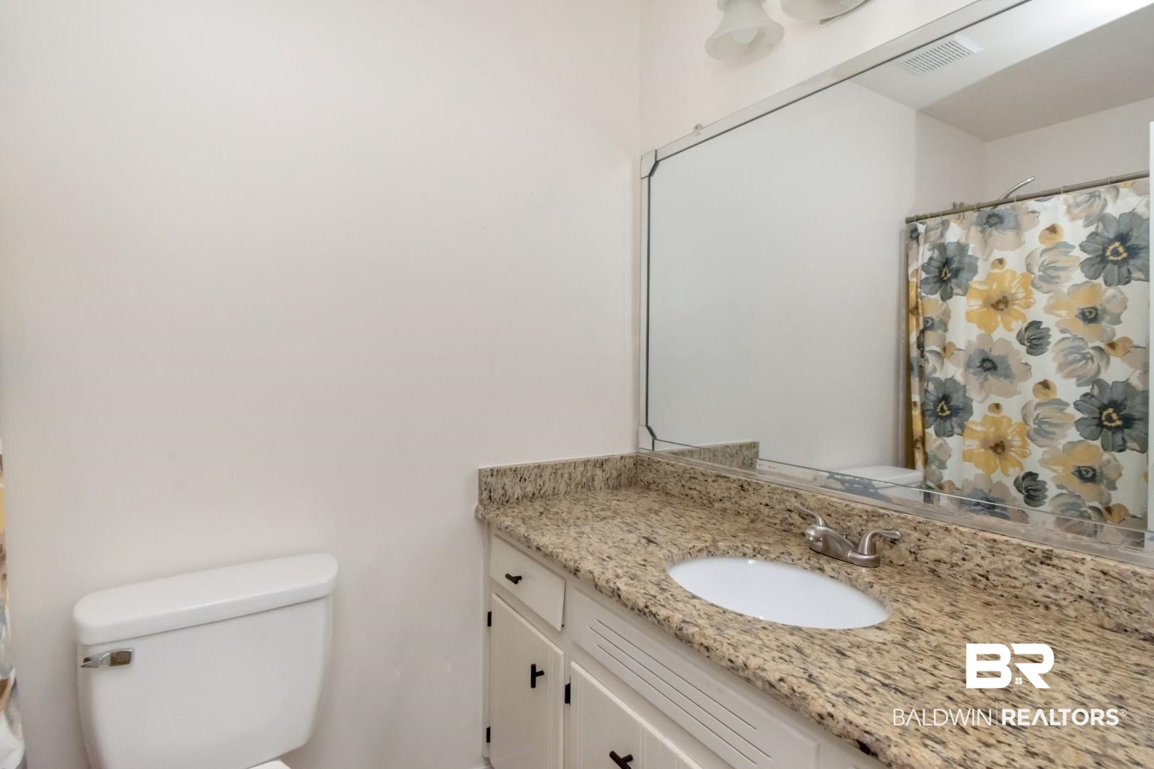 9410 Ashwood Court Mobile, AL 36695 - Photo 14 of 20 Bathroom with a shower with shower curtain and vanity
