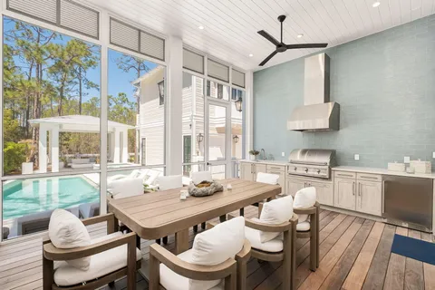 a dining room with furniture and wooden floor