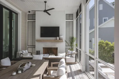 a living room with furniture fireplace and a flat screen tv
