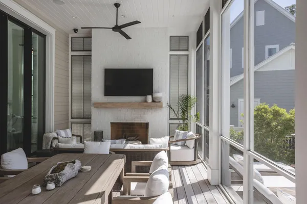 a living room with furniture fireplace and a flat screen tv