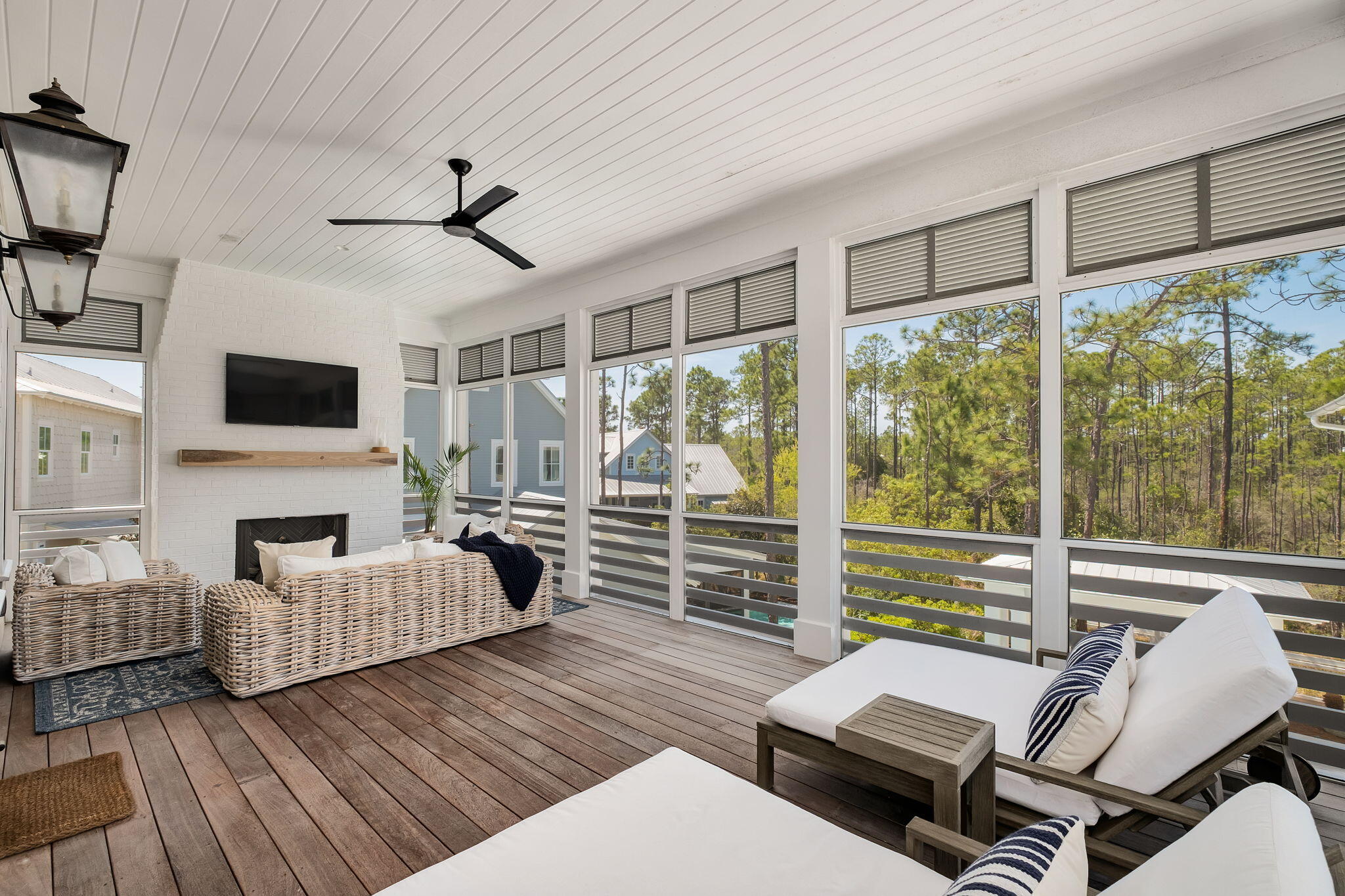565 East Royal Fern Way Santa Rosa Beach, FL 32459 - Photo 18 of 24 a living room with furniture a fireplace and a floor to ceiling window