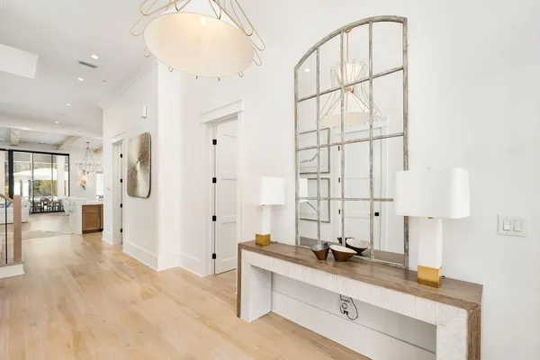 a spacious bathroom with a double vanity sink a mirror and shower