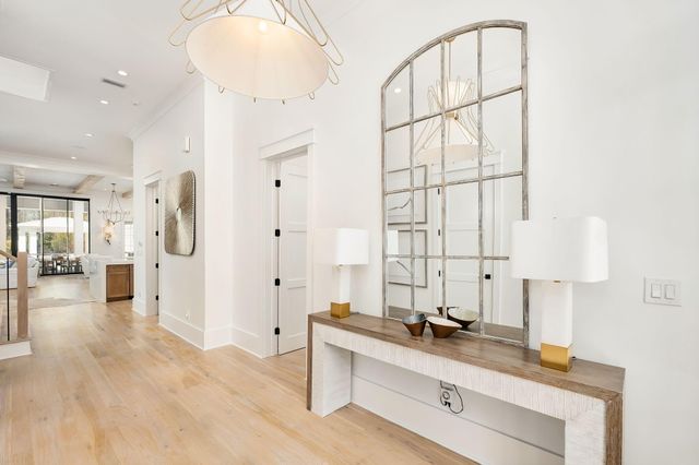 a spacious bathroom with a double vanity sink a mirror and shower