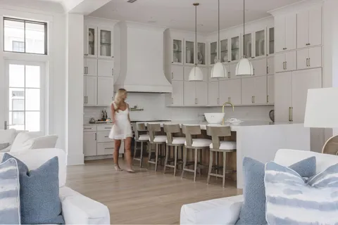 a view of kitchen with dining area wooden floor and windows