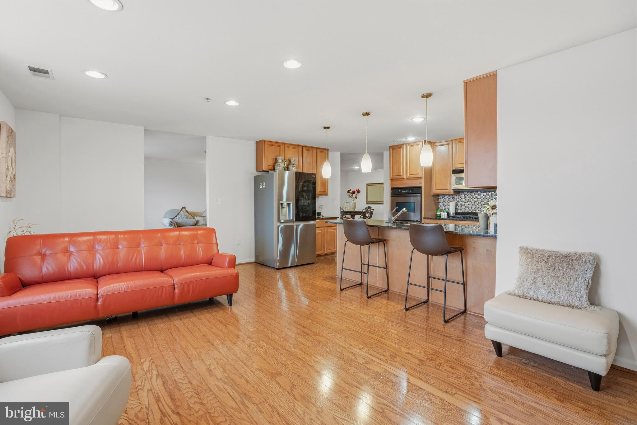 9500 Sidebrook Road, Unit 406 Owings Mills, MD 21117 - Photo 18 of 35 a living room with furniture and kitchen view