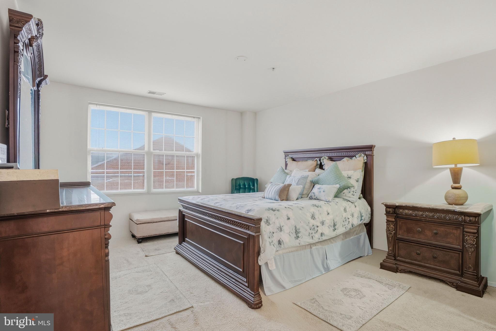 9500 Sidebrook Road, Unit 406 Owings Mills, MD 21117 - Photo 23 of 35 a bedroom with a bed and a window