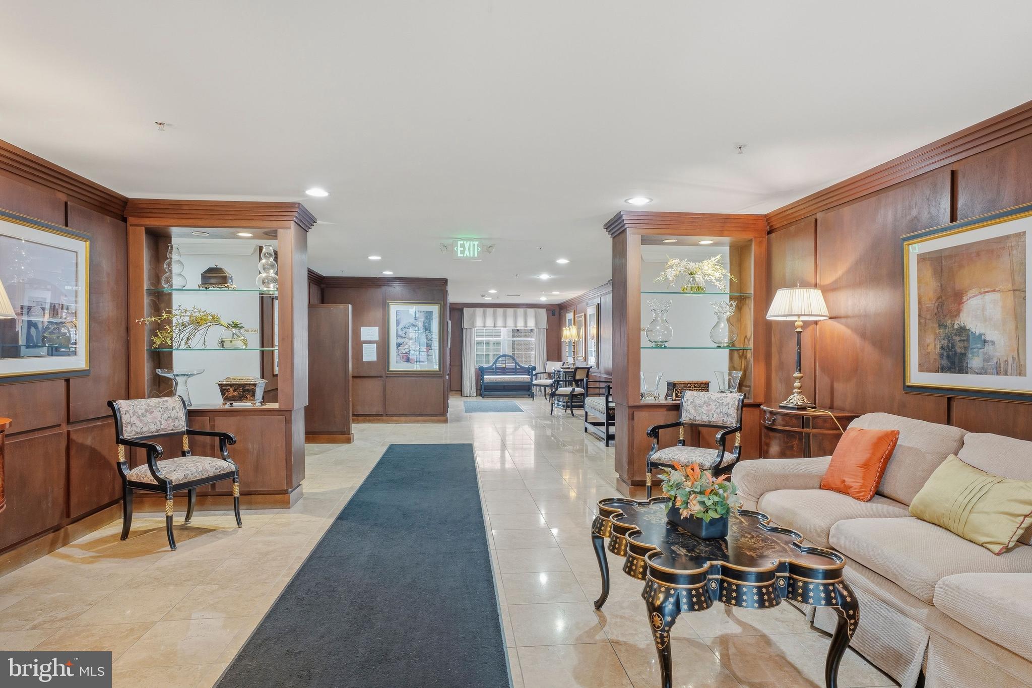 9500 Sidebrook Road, Unit 406 Owings Mills, MD 21117 - Photo 3 of 35 a living room with furniture and a table