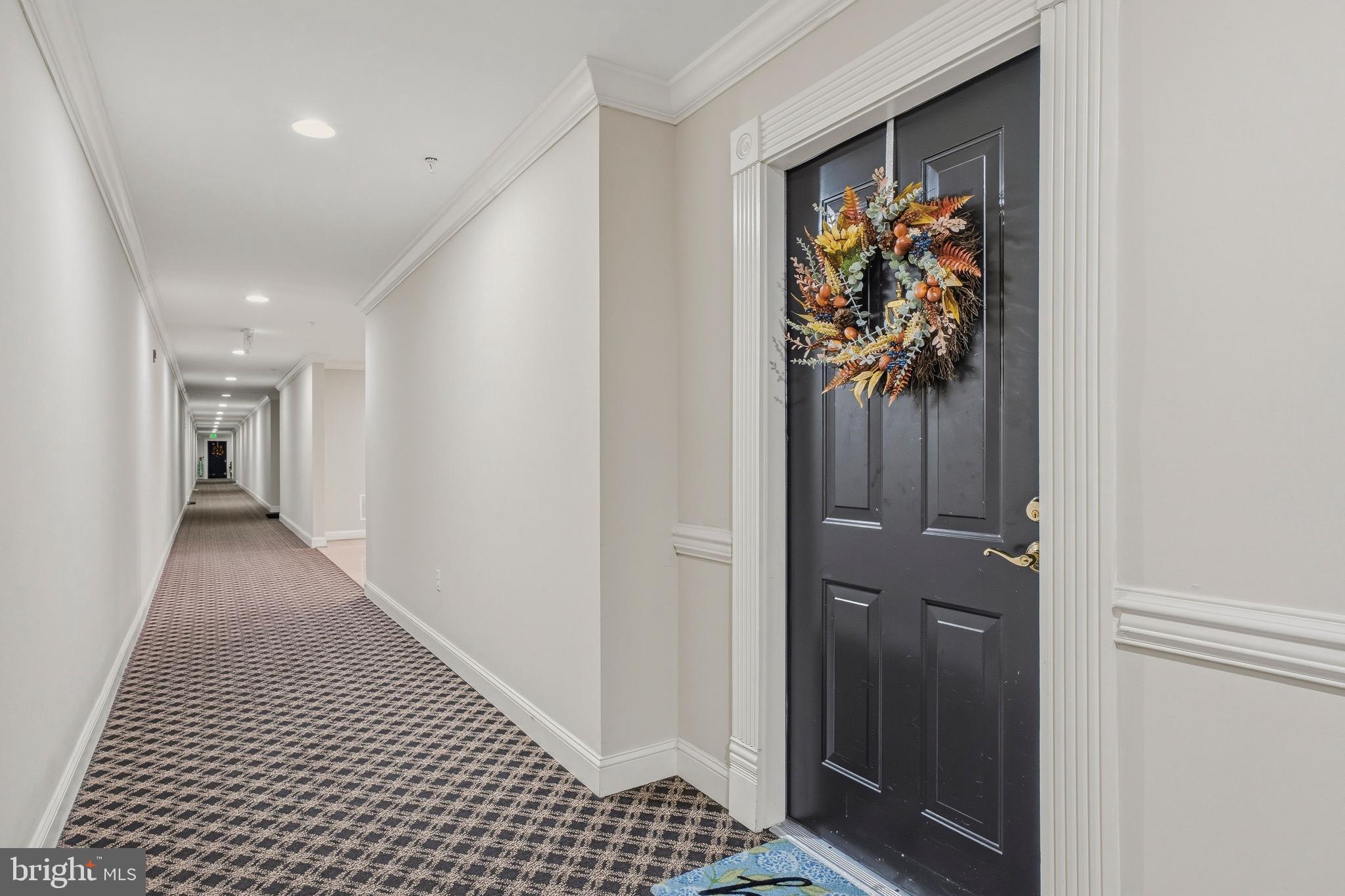 9500 Sidebrook Road, Unit 406 Owings Mills, MD 21117 - Photo 5 of 35 a view of hallway with wooden floor