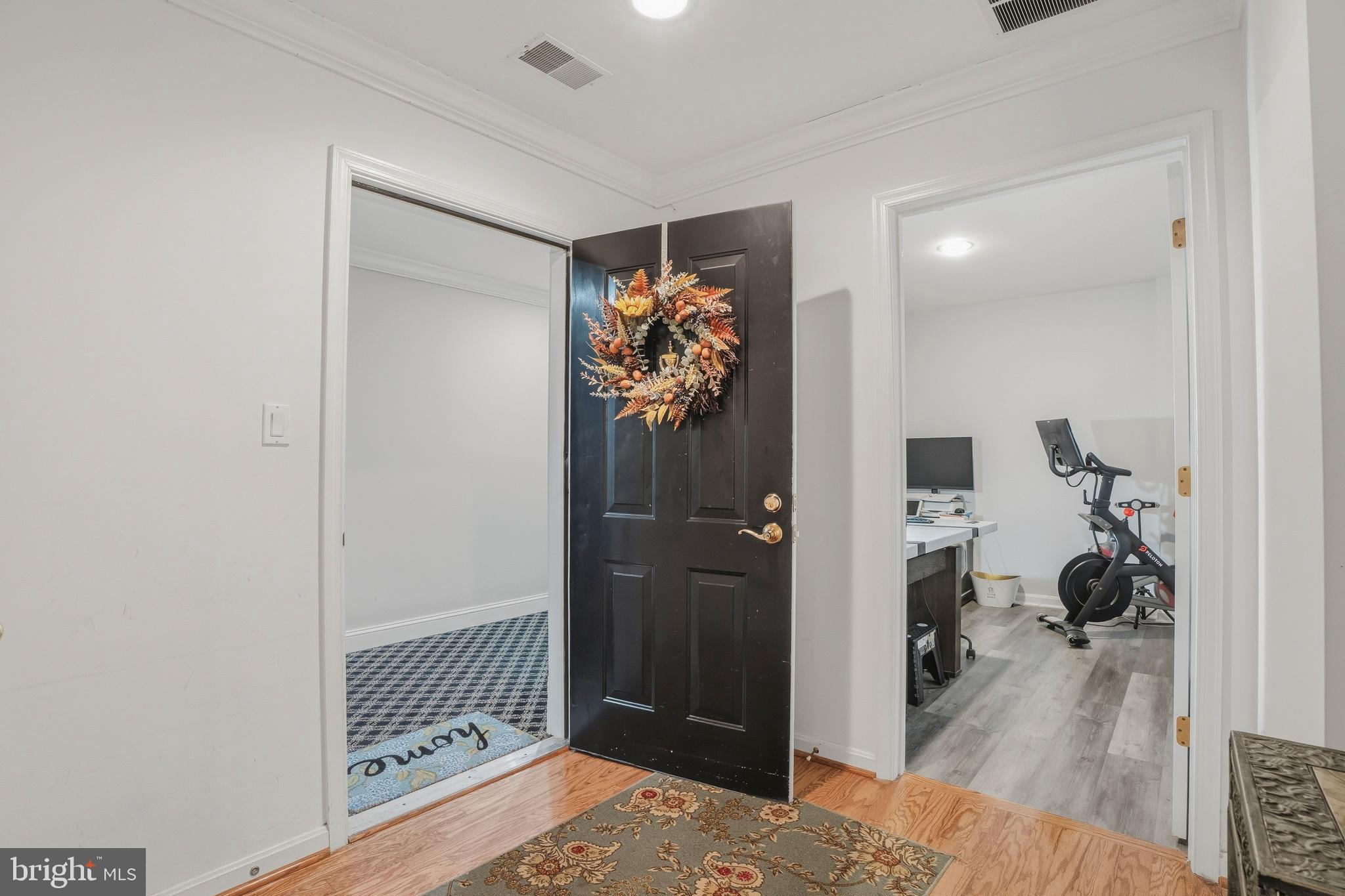 9500 Sidebrook Road, Unit 406 Owings Mills, MD 21117 - Photo 6 of 35 a view of a hallway to a livingroom and a livingroom with furniture