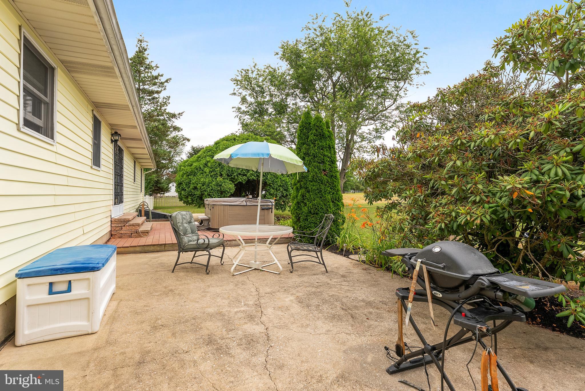 1989 Monroeville Road Monroeville, NJ 08343 - Photo 31 of 36 a view of a patio with a table and chairs under an umbrella