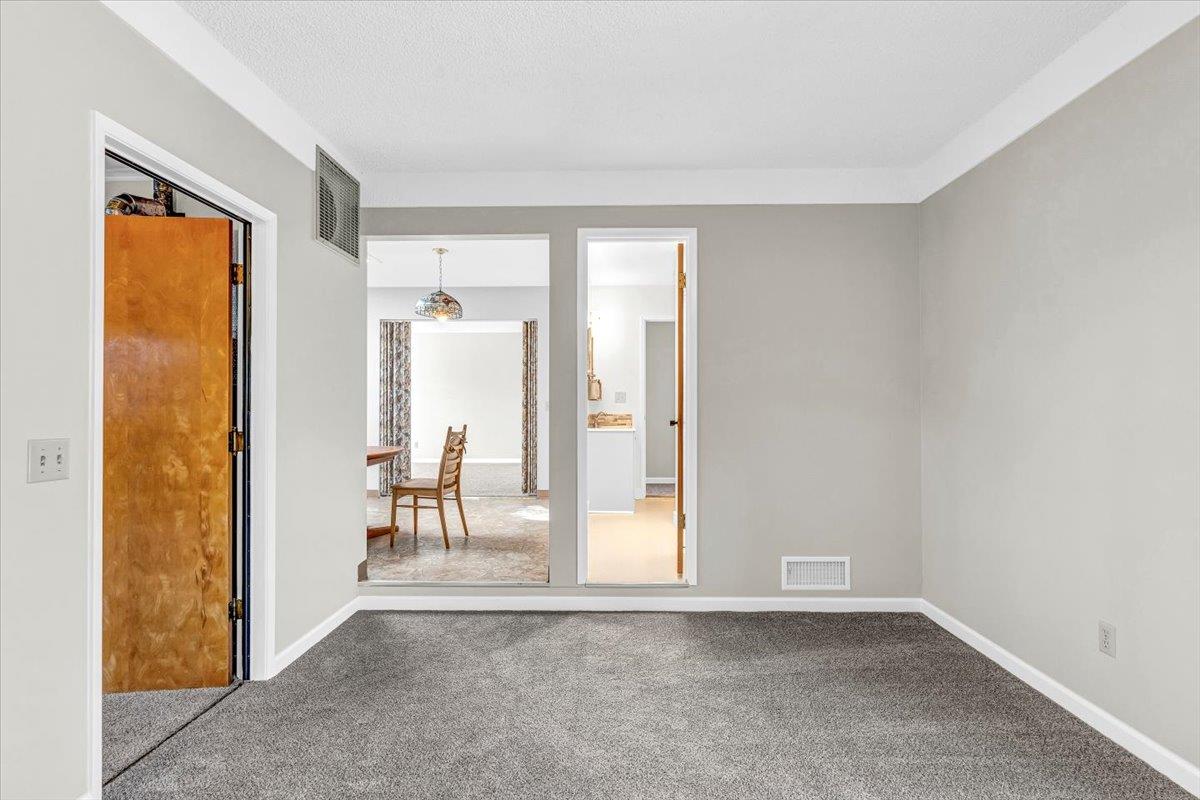 3111 Carmelo Circle Marina, CA 93933 - Photo 14 of 35 an empty room with a fireplace and a window