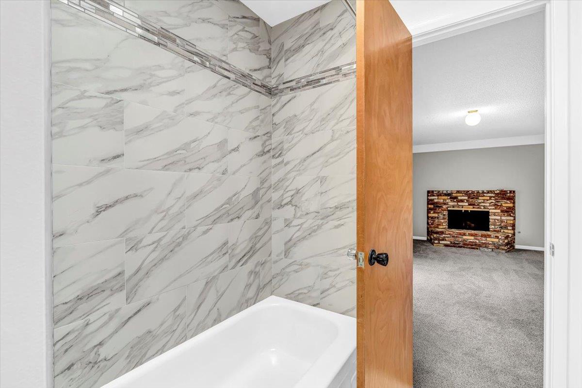 3111 Carmelo Circle Marina, CA 93933 - Photo 17 of 35 a bathroom with a sink and a shower