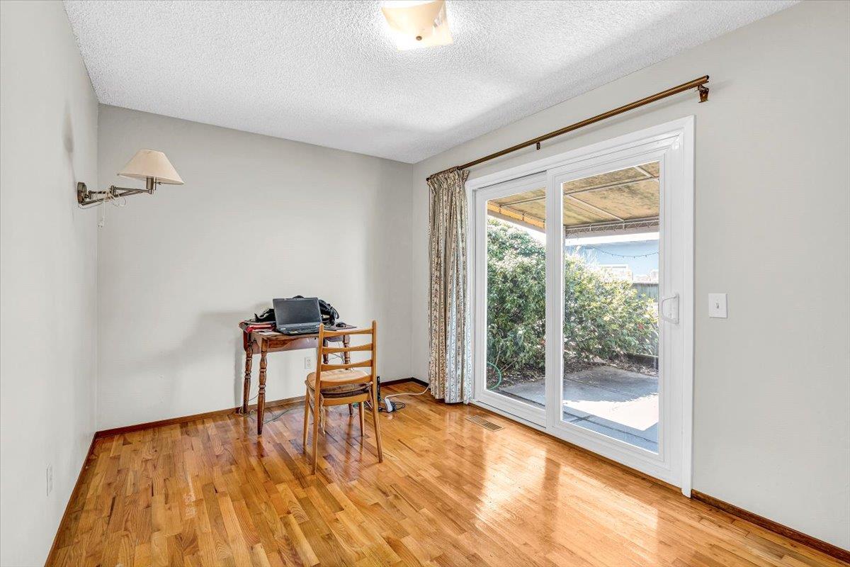 3111 Carmelo Circle Marina, CA 93933 - Photo 19 of 35 a living room with a wooden floor and a table