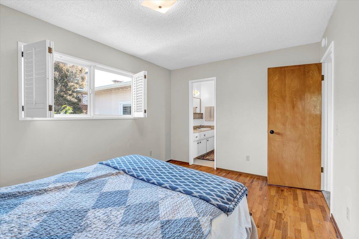 3111 Carmelo Circle Marina, CA 93933 - Photo 23 of 35 a bedroom with a bed and a window