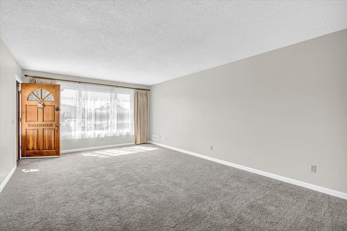 3111 Carmelo Circle Marina, CA 93933 - Photo 7 of 35 a view of an empty room with a window