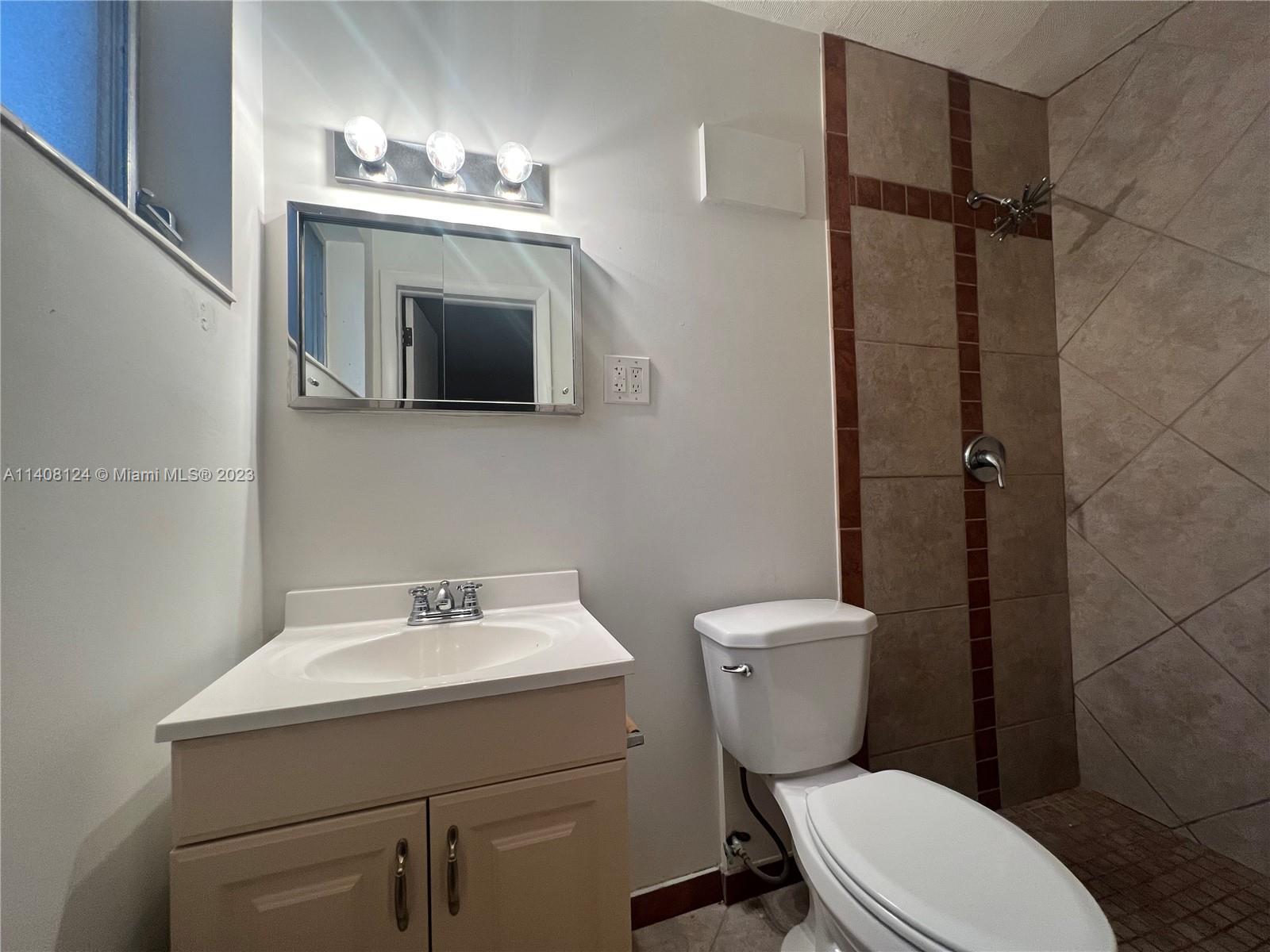 5507 Southwest 7th Court Margate, FL 33068 - Photo 12 of 21 a bathroom with a toilet sink and shower