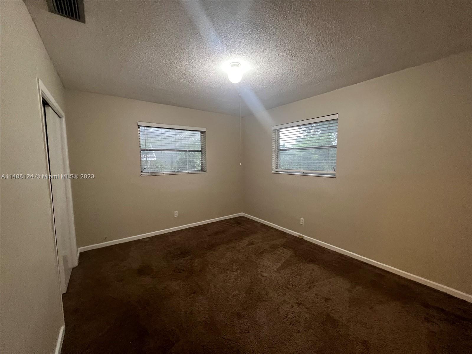 5507 Southwest 7th Court Margate, FL 33068 - Photo 13 of 21 an empty room with windows