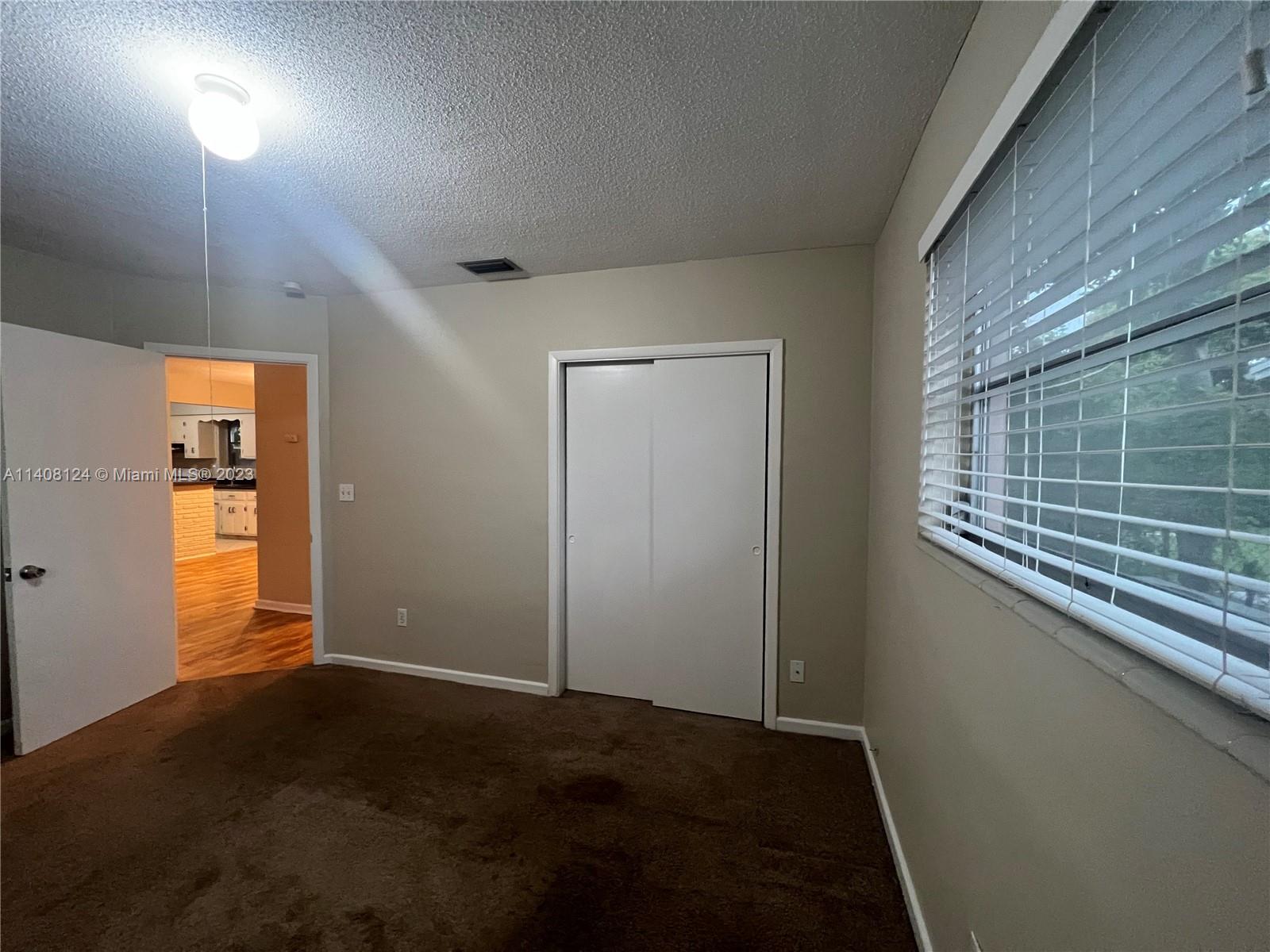 5507 Southwest 7th Court Margate, FL 33068 - Photo 14 of 21 a view of an empty room with a window
