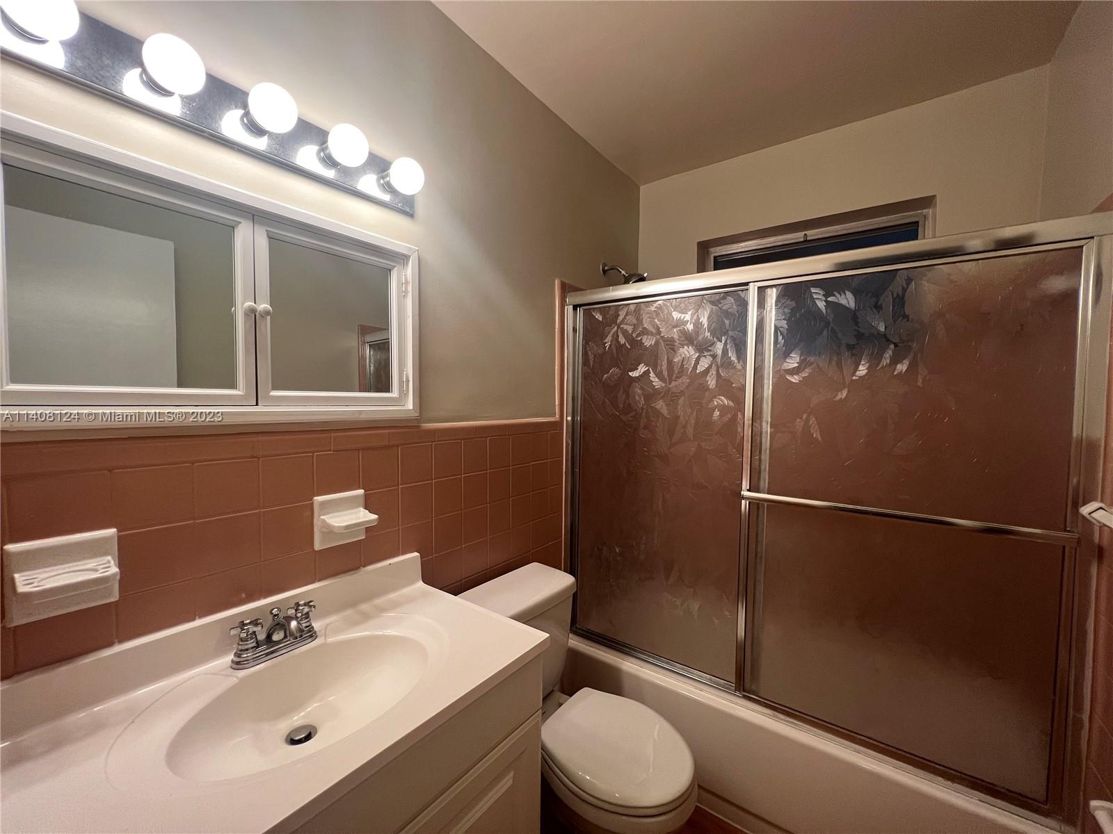 5507 Southwest 7th Court Margate, FL 33068 - Photo 15 of 21 a bathroom with a sink a mirror and a toilet