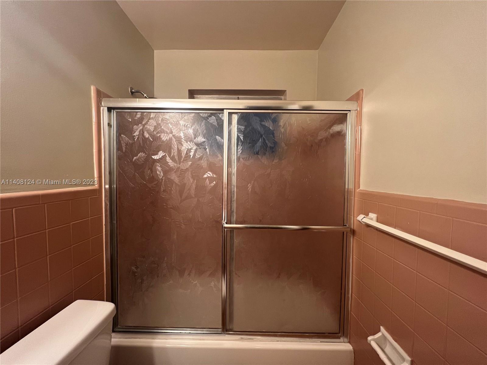 5507 Southwest 7th Court Margate, FL 33068 - Photo 16 of 21 a bathroom with a shower and a toilet