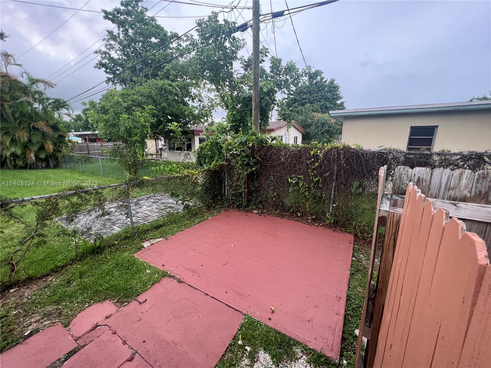 5507 Southwest 7th Court Margate, FL 33068 - Photo 21 of 21 a view of a backyard with plants and a patio