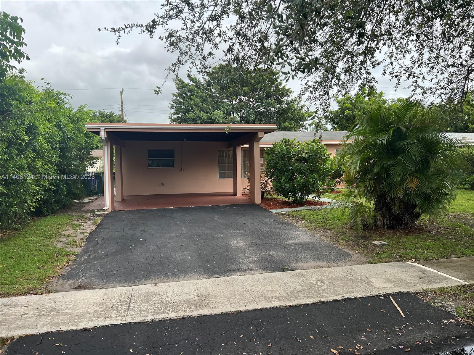 5507 Southwest 7th Court Margate, FL 33068 - Photo 3 of 21 a front view of a house with garden