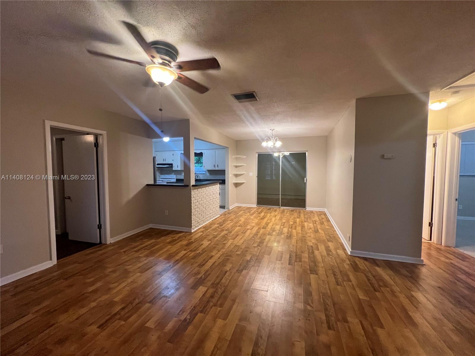 5507 Southwest 7th Court Margate, FL 33068 - Photo 9 of 21 a view of empty room with wooden floor
