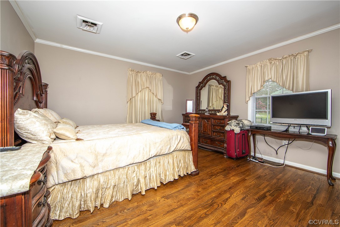 5505 Raleigh Road Henrico, VA 23231 - Photo 11 of 30 a bedroom with bed and a flat tv screen on the dresser