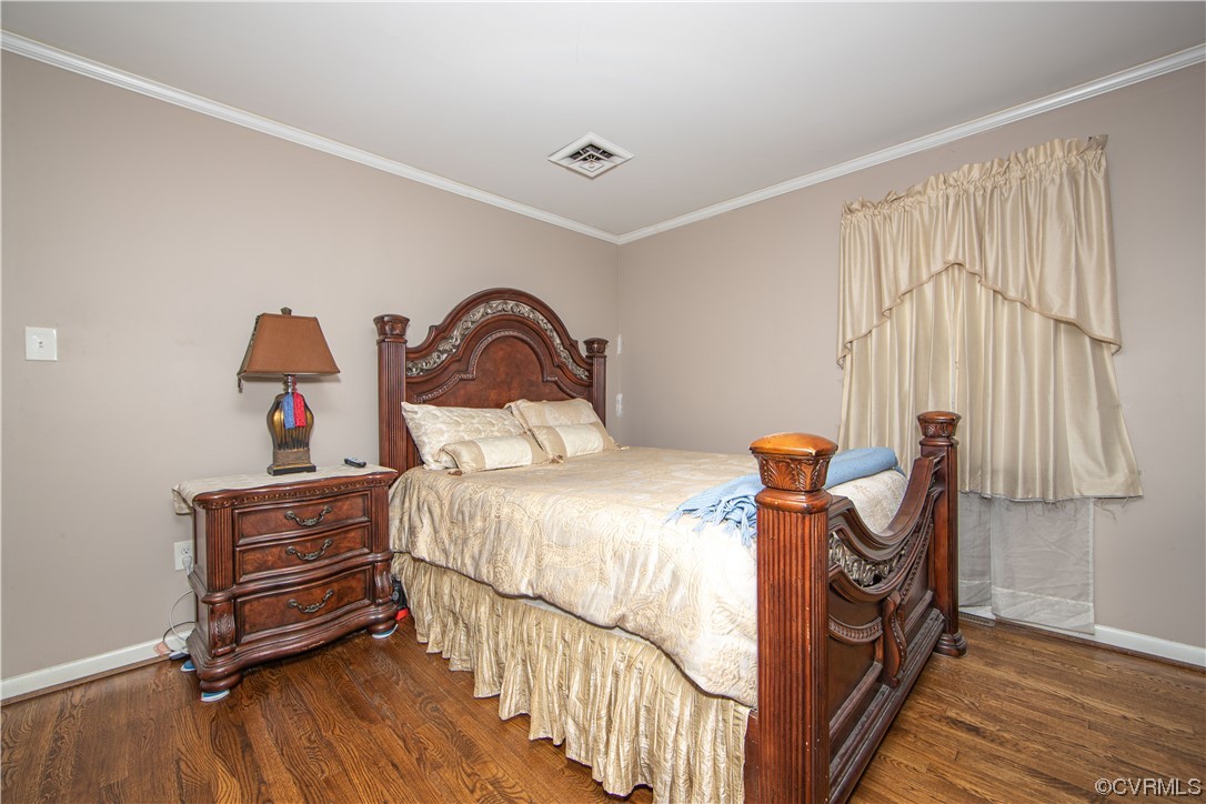 5505 Raleigh Road Henrico, VA 23231 - Photo 12 of 30 a bedroom with a bed and a dresser