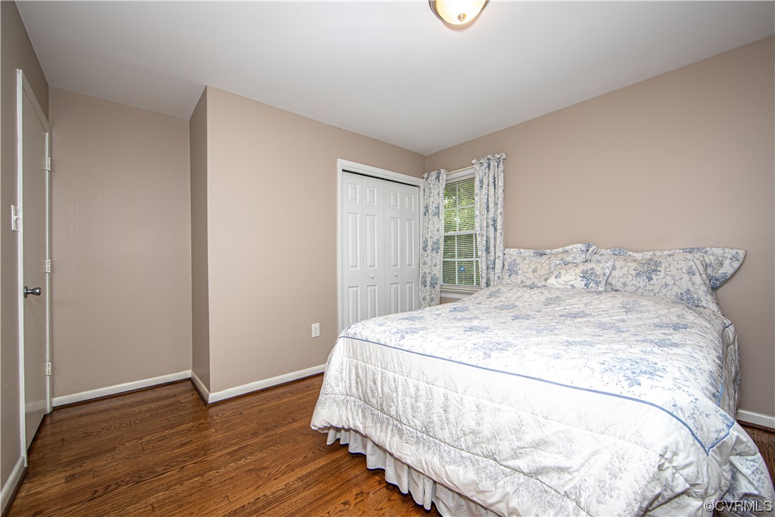 5505 Raleigh Road Henrico, VA 23231 - Photo 16 of 30 a bed sitting in a bedroom next to a window