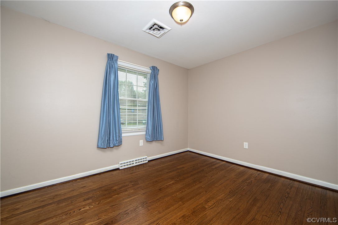 5505 Raleigh Road Henrico, VA 23231 - Photo 17 of 30 an empty room with wooden floor and windows