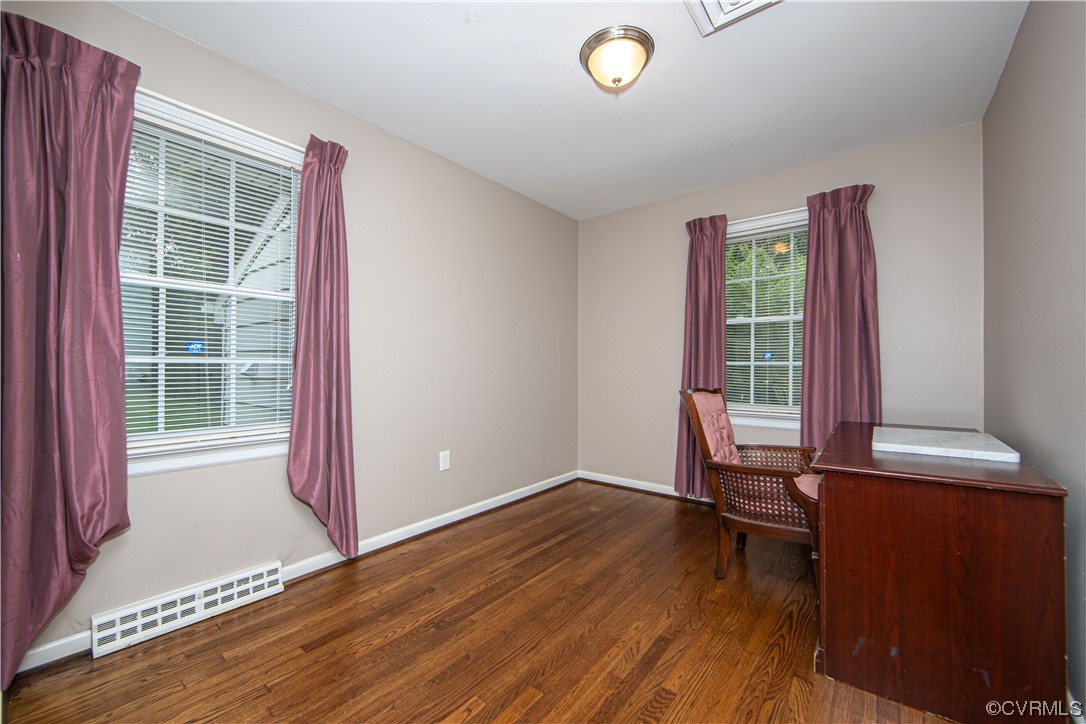 5505 Raleigh Road Henrico, VA 23231 - Photo 19 of 30 an empty room with wooden floor and windows