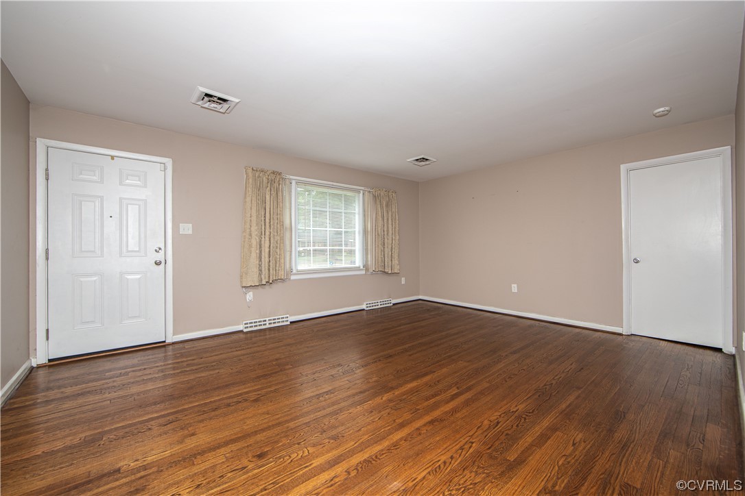 5505 Raleigh Road Henrico, VA 23231 - Photo 2 of 30 an empty room with wooden floor and windows