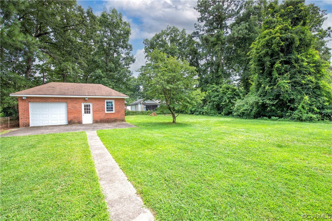 5505 Raleigh Road Henrico, VA 23231 - Photo 26 of 30 a front view of a house with yard and green space