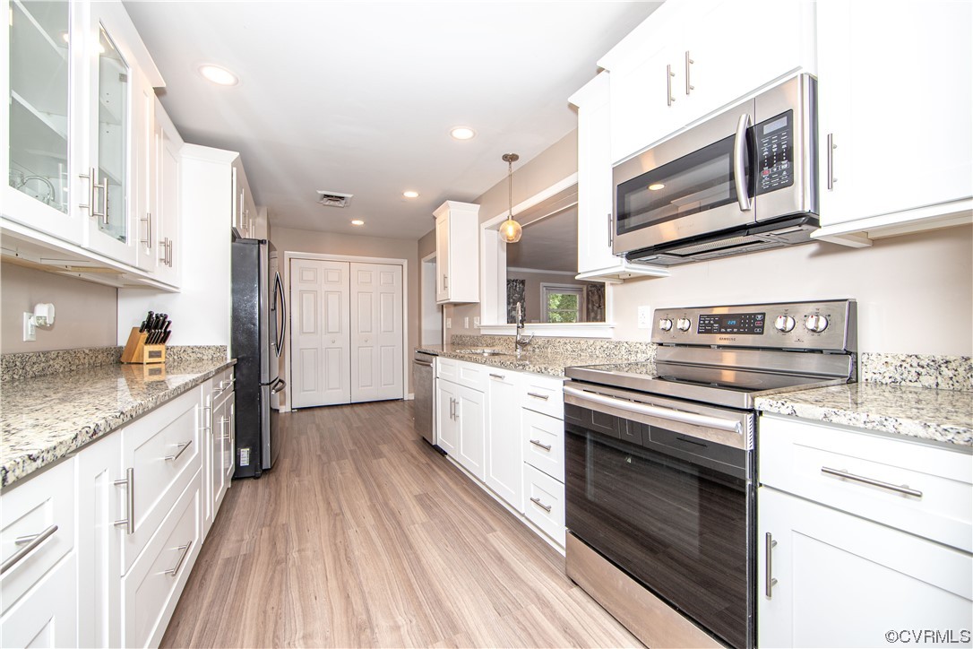 5505 Raleigh Road Henrico, VA 23231 - Photo 6 of 30 a kitchen with stainless steel appliances granite countertop a stove and cabinets