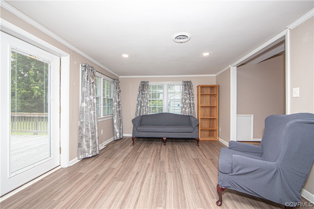 5505 Raleigh Road Henrico, VA 23231 - Photo 7 of 30 a living room with a bed and wooden floor